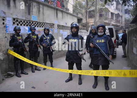 (180112) -- DHAKA, Jan. 12, 2018 -- Members of Rapid Action Battalion gather during a raid in Dhaka, capital of Bangladesh, Jan. 12, 2018. Three militants were killed on Friday morning in a raid launched by Bangladesh s anti-crime elite force on a militant hideout near Prime Minister Sheikh Hasina s office in capital Dhaka. ) (djj) BANGLADESH-DHAKA-MILITANT-HIDEOUT-RAID SalimxReza PUBLICATIONxNOTxINxCHN Stock Photo
