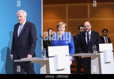 (180112) -- BERLIN, Jan. 12, 2018 -- German Chancellor and leader of German Christian Democratic Union (CDU) Angela Merkel (C front), leader of German Christian Social Union (CSU) Horst Seehofer (L front) and leader of German Social Democratic Party (SPD) Martin Schulz (R front) arrive for a joint press conference after coalition talks at the headquarters of SPD, in Berlin, Germany, on Jan. 12, 2018. German Chancellor Angela Merkel s conservatives and the Social Democrats (SPD) on Friday achieved a breakthrough in their exploratory talks aimed at forming a new coalition government, local media Stock Photo