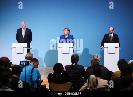 (180112) -- BERLIN, Jan. 12, 2018 -- German Chancellor and leader of German Christian Democratic Union (CDU) Angela Merkel (C), leader of German Christian Social Union (CSU) Horst Seehofer (L) and leader of German Social Democratic Party (SPD) Martin Schulz attend a joint press conference after coalition talks at the headquarters of SPD, in Berlin, Germany, on Jan. 12, 2018. German Chancellor Angela Merkel s conservatives and the Social Democrats (SPD) on Friday achieved a breakthrough in their exploratory talks aimed at forming a new coalition government, local media reported. )(srb) GERMANY- Stock Photo