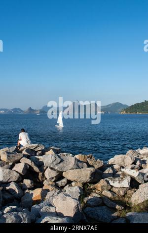 Rio de Janeiro, Brazil: man relaxing in the Flamengo Park (Aterro do Flamengo), the largest public park and recreation area in the city Stock Photo