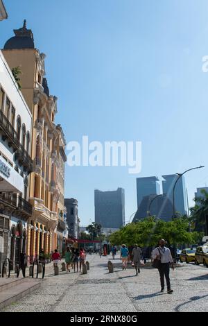 Rio de Janeiro, Brazil: people in the streets of Lapa district with the Metropolitan Cathedral of Saint Sebastian on the background Stock Photo