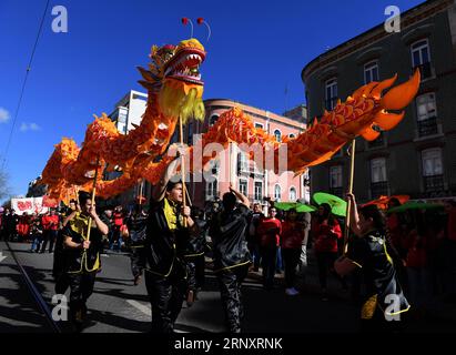 (180211) -- LISBON, Feb. 11, 2018 -- Portuguese perform dragon dance during Happy Chinese New Year celebration in Lisbon, capital of Portugal on Feb. 10, 2018. )(yk) PORTUGAL-LISBON-CHINESE NEW YEAR-CELEBRATION ZhangxLiyun PUBLICATIONxNOTxINxCHN Stock Photo