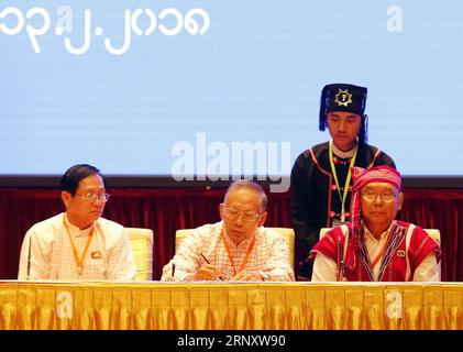 (180213) -- NAY PYI TAW, Feb. 13, 2018 -- New Mon State Party (NMSP) chairman Nai Htaw Mon (C), signs documents during the signing ceremony of Nationwide Ceasefire Accord at the Myanmar International Convention Center (MICC) in Nay Pyi Taw, Myanmar, Feb. 13, 2108. Myanmar government and two more ethnic armed groups signed the Nationwide Ceasefire Accord (NCA) in Nay Pyi Taw Tuesday. ) (srb) MYANMAR-NAY PYI TAW-NATIONWIDE CEASEFIRE ACCORD-SIGNING CEREMONY UxAung PUBLICATIONxNOTxINxCHN Stock Photo