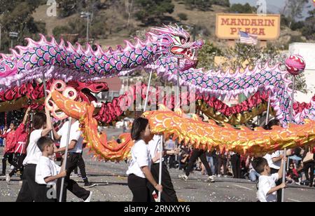 (180218) -- LOS ANGELES, Feb. 18, 2018 -- Dragon dancers perform during the 119th Golden Dragon Parade held to celebrate the Chinese Lunar New Year in the streets of Chinatown in Los Angeles, the United States, Feb. 17, 2018. ) (zjl) US-LOS ANGELES-PARADE-CHINESE NEW YEAR ZhaoxHanrong PUBLICATIONxNOTxINxCHN Stock Photo