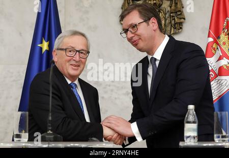 (180226) -- BELGRADE, Feb. 26, 2018 -- European Commission President Jean-Claude Juncker (L) shakes hands with Serbian President Aleksandar Vucic during a press conference in Belgrade, Serbia on Feb. 26. 2018. The European Union is keen to receive Serbia and other Western Balkans countries as members when they meet preconditions, Juncker told Serbian president Aleksandar Vucic on Monday. ) SERBIA-BELGRADE-EU-JUNCKER-HAHN-VISIT PredragxMilosavljevic PUBLICATIONxNOTxINxCHN Stock Photo