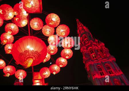 (180302) -- BEIJING, March 2, 2018 -- Chinese lanterns and the tower of City Hall are illuminated at the Grand Place in Brussels, Belgium, Feb. 22, 2018. Lantern Festival, when the first full moon of a lunar new year appears, marks the end of the Spring Festival celebrations. Traditionally, Chinese people make lanterns to celebrate this festival, which symbolize reunion and carry their wishes. Nowadays, modern lanterns are designed to illuminate the night and create a festive atmosphere. ) (xzy) (FESTIVECHINA)CHINA-LANTERN FESTIVAL-LANTERNS(CN) YexPingfan PUBLICATIONxNOTxINxCHN Stock Photo