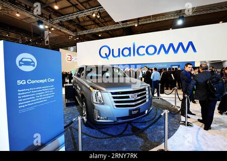 (180303) -- BEIJING, March 3, 2018 -- People visit the Qualcomm 5G Concept Car on the first day of the 2018 Mobile World Congress (MWC) in Barcelona, Spain, on Feb. 26, 2018. The International Telecommunication Union (ITU), the Geneva-based affiliate of the United Nations that governs issues concerning information and communication technologies, has set 2020 as the target year for completing the international standardization of 5G technologies so as to pave the way for its mass adoption, according to a roadmap the ITU refers to as IMT-2020. However, there are signs that the ITU s timeframe may Stock Photo