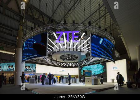 (180303) -- BEIJING, March 3, 2018 -- People visit ZTE s booth during the first day of the 2018 Mobile World Congress (MWC) in Barcelona, Spain on Feb. 26, 2018. The International Telecommunication Union (ITU), the Geneva-based affiliate of the United Nations that governs issues concerning information and communication technologies, has set 2020 as the target year for completing the international standardization of 5G technologies so as to pave the way for its mass adoption, according to a roadmap the ITU refers to as IMT-2020. However, there are signs that the ITU s timeframe may be too conse Stock Photo