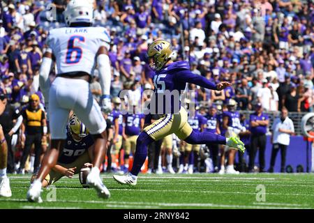 Washington Huskies place kicker Grady Gross (95) kicks off to start the ...