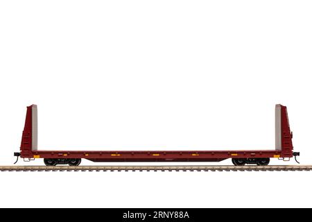 A railroad bulkhead flat car on track. Stock Photo