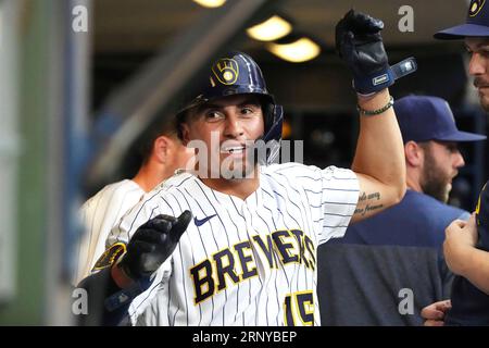 Milwaukee Brewers' Tyrone Taylor (15) removes his helmet after striking out  during the third inning of a baseball game against the Miami Marlins,  Friday, May 7, 2021, in Miami. (AP Photo/Lynne Sladky