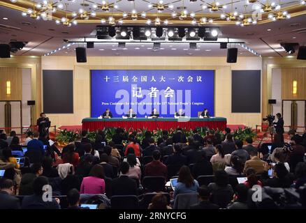 (180311) -- BEIJING, March 11, 2018 -- Chinese Minister of Commerce Zhong Shan, Vice Minister of Commerce and Deputy China International Trade Representative Wang Shouwen, and Vice Minister of Commerce Qian Keming attend a press conference on opening up on all fronts and promoting high quality development of commercial business on the sidelines of the first session of the 13th National People s Congress in Beijing, capital of China, March 11, 2018. ) (TWO SESSIONS)CHINA-BEIJING-NPC-PRESS CONFERENCE-COMMERCE (CN) LixXin PUBLICATIONxNOTxINxCHN Stock Photo