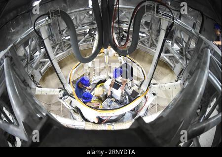 (180313) -- GUIYANG, March 13, 2018 -- File photo taken on Aug. 10, 2017, shows staff members working in the feed cabin of the Five-hundred-meter Aperture Spherical Radio Telescope (FAST) in Pingtang County, southwest China s Guizhou Province. China s FAST, the world s largest single-dish radio telescope, has discovered 11 new pulsars so far, the National Astronomical Observatories of China (NAOC) said Tuesday. )(wsw) CHINA-GUIZHOU-FAST-11 NEW PULSARS (CN) OuxDongqu PUBLICATIONxNOTxINxCHN Stock Photo