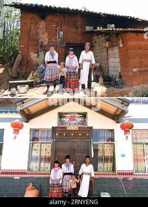 (180315) -- BEIJING, March 15, 2018 -- Combined file photos taken on May 1, 2017 show the old mud-brick house (upper) and the new house (lower) of Yang Guangxue s family in the Chushuiqing Village in Luquan Yi and Miao Autonomous County, southwest China s Yunnan Province. In 2016, Chushuiqing villagers moved from the mud-brick houses they lived for years into newly built houses with the help of local government. China has pledged to lift another 10 million people out of poverty in its rural areas in 2018. The ambitious call for action demonstrates the country s earnest efforts to eliminate pov Stock Photo