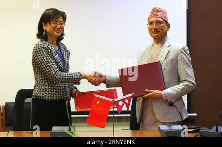 (180315) -- KATHMANDU, March 15, 2018 -- Chinese Ambassador to Nepal Yu Hong (L) shakes hands with Nepal s Secretary at Ministry of Finance Shankar Prasad Adhikari after signing agreements on China-Aid projects in Kathmandu, Nepal, on March 15, 2018. China and Nepal agreed on Thursday to construct a frontier inspection station and facilitate resumption of Nepal-China border point, which has been closed after a devastating earthquake in 2015. ) (swt) NEPAL-KATHMANDU-CHINA-SIGNING CEREMONY SunilxSharma PUBLICATIONxNOTxINxCHN Stock Photo