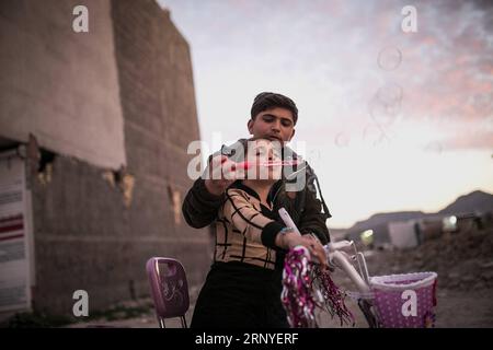 (180315) -- SARPOL-E ZAHAB, March 15, 2018 -- Paria plays with her brother, Omid, in Sarpol-e Zahab city, western Iran, on March 11, 2018. Paria, 10-year-old Iranian-Kurdish girl, lost her father during a 7.3-magnitude earthquake on Nov. 12, 2017. Now, she is living with her mother and only brother in a conex home, as their house was completely destroyed during the tremor. She has had her father as the hero of her life, she sobbed. Asked what her top dream in her life is, she dropped her head saying in low voice: I cannot think of another disaster like this for anybody in the world. ) (swt) IR Stock Photo