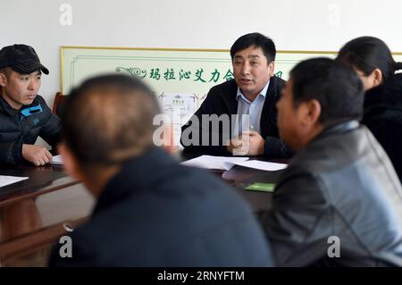(180318) -- BEIJING, March 18, 2018 -- Wu Yunbo discusses the sale performance of beef products with board directors of the cooperative at Dongsala Village in Jarud Qi (County), north China s Inner Mongolia Autonomous Region, Feb. 25, 2018. Wu Yunbo of Mongolia ethnic group comes from Dongsala Village of Jarud Qi (County) of north China s Inner Mongolia Autonomous Region. As a secretary of the Communist Party of China local branch in the Dongsala Village, he initiated a cooperative in 2013 and explored a way to get people out of poverty. Farmers and herdsmen were encouraged to join the coopera Stock Photo