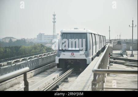 (180324) -- SHANGHAI, March 24, 2018 -- Photo taken on March 23, 2018 shows a subway train running on the first APM line, or the Automated People Mover system, in Shanghai, east China. A new metro line with driverless trains is expected to be tested by the end of March in Shanghai, the Shanghai Shentong Metro Group announced on Friday. ) (zwx) CHINA-SHANGHAI-APM-TRIAL RUN (CN) DingxTing PUBLICATIONxNOTxINxCHN Stock Photo