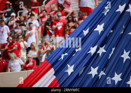 Bloomington, USA. 02nd Sep, 2023. BLOOMINGTON, INDIANA - SEPTEMBER 2: Indiana Hoosiers fans stand during the playing of the United States National Anthem before an NCAA football game against Ohio State on September 2, 2023 in Bloomington, Indiana. The Buckeyes beat the Hoosiers 23-3. ( Credit: Jeremy Hogan/Alamy Live News Stock Photo
