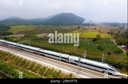 (180329) -- HAIKOU, March 29, 2018 -- Photo taken on March 6, 2018 shows a bullet train running on the western track of the high-speed loop line near Qiziwan Railway Station, south China s Hainan Province. The 653-km high-speed railway line circling the island received over 25 million passengers in 2017. )(wsw) CHINA-HAINAN-HIGH-SPEED LOOP LINE (CN) YangxGuanyu PUBLICATIONxNOTxINxCHN Stock Photo