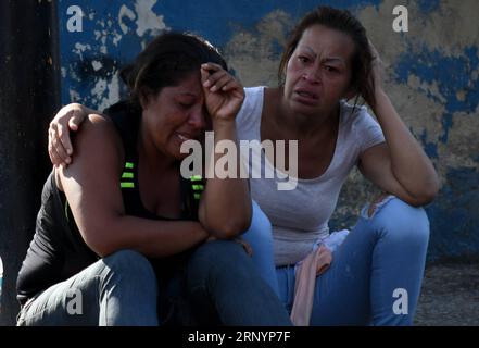 (180329) -- CARABOBO, March 29, 2018 -- Relatives react as they wait for information after an alleged fire at a Venezuelan police station, in Valencia, Carabobo state, Venezuela, on March 28, 2018. A prison riot and fire has broken out at a Venezuelan police station in the central city of Valencia and at least 68 people were killed, Venezuelan officials said Wednesday. ) (vf) (ce)(swt) VENEZUELA-CARABOBO-FIRE-JAIL RomanxCamacho/SOPA/ZUMAPRESS PUBLICATIONxNOTxINxCHN Stock Photo