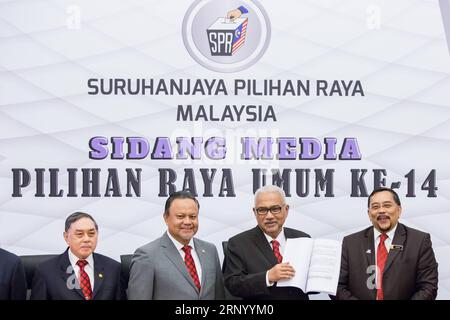(180410) -- KUALA LUMPUR, April 10, 2018 -- Mohd Hashim bin Abdullah (2nd R), chairman of Malaysia s Election Commission, attends a press conference in Putrajaya April 10, 2018. Malaysia will hold general elections on May 9, said the Election Commission on Tuesday, days after Prime Minister Najib Razak announced the dissolution of the parliament. ) (ybg) MALAYSIA-KUALA LUMPUR-GENERAL ELECTIONS-SCHEDULE ZhuxWei PUBLICATIONxNOTxINxCHN