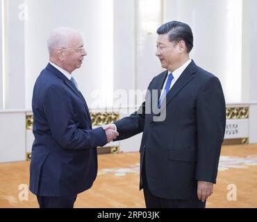 (180416) -- BEIJING, April 16, 2018 -- Chinese President Xi Jinping (R) meets with Klaus Schwab, founder and executive chairman of the World Economic Forum (WEF), in Beijing, capital of China, April 16, 2018. ) (zwx) CHINA-BEIJING-XI JINPING-WEF-SCHWAB-MEETING (CN) LixTao PUBLICATIONxNOTxINxCHN Stock Photo