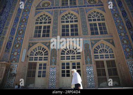 (180418) -- HERAT, April 18, 2018 -- An Afghan man walks at the Masjid-e Jami mosque in Herat city, a UNESCO World Heritage Site, in Afghanistan, April 16, 2018. )(srb) ) () AFGHANISTAN-HERAT-WORLD HERITAGE SITE RahmatxAlizadah PUBLICATIONxNOTxINxCHN Stock Photo