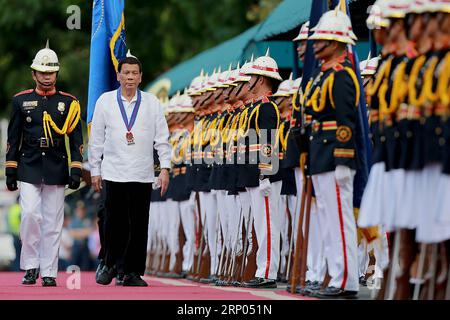 (180419) -- QUEZON CITY, April 19, 2018 -- Philippine President Rodrigo Duterte (2nd L) reviews honor guards of the Philippine National Police (PNP) during the PNP s command handover ceremony inside Camp Crame in Quezon City, the Philippines, April 19, 2018. Philippine President Rodrigo Duterte named Oscar Albayalde as the new head of the PNP on April 5 and the command handover ceremony was held here on Thursday. ) (zjl) PHILIPPINES-QUEZON CITY-PNP-COMMAND-HANDOVER RouellexUmali PUBLICATIONxNOTxINxCHN Stock Photo