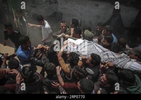 (180424) -- GAZA, April 24, 2018 -- Mourners carry the body of deaf Palestinian Tahrir Wahba, 18, during his funeral, in the southern Gaza Strip city of Khan Yunis, on April 23, 2018. The Palestinian teenager Wahba died Monday morning when he was shot in the head by Israeli troops gunfire and was in critical condition. ) MIDEAST-GAZA-FUNERAL WissamxNassar PUBLICATIONxNOTxINxCHN Stock Photo