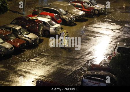 (180425) -- CAIRO, April 25, 2018 -- Pedestrians walk in the rain in Cairo, Egypt, on April 25, 2018. Several parts of Cairo and Giza witnessed heavy rainfall with lightning and thunder on Wednesday. ) EGYPT-CAIRO-HEAVY RAIN AhmedxGomaa PUBLICATIONxNOTxINxCHN Stock Photo