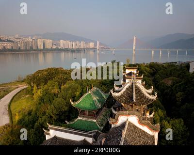 (180502) -- CHONGQING, May 2, 2018 -- Aerial photo taken on Nov. 7, 2017 shows the Zhangfei Temple on the upper Yangtze River, in Yunyang County in Chongqing Municipality, southwest China. Environmental protection measures taken in recent years have greatly greened banks of the Yangtze River in Chongqing area. ) (sxk) CHINA-CHONGQING-ENVIRONMENT PROTECTION (CN) LiuxChan PUBLICATIONxNOTxINxCHN Stock Photo