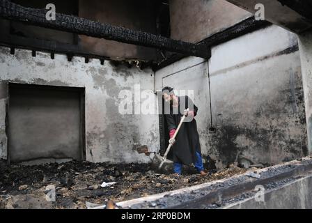 (180503) -- SRINAGAR, May 3, 2018 -- A Kashmiri man cleans a house destroyed by gunfight at Turkawangam village of Shopian district, about 45 km south of Srinagar city in the summer capital of Indian-controlled Kashmir, on May 3, 2018. A civilian was killed and 10 others injured Wednesday after government forces fired upon protesters near village Turkawangam in Shopian district of Indian-controlled Kashmir, police said. ) (wtc) INDIA-KASHMIR-SRINAGAR-GUNFIRE JavedxDar PUBLICATIONxNOTxINxCHN Stock Photo