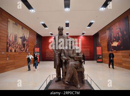 180505 -- BEIJING, May 5, 2018 -- A sculpture of Karl Marx R sitting next to Friedrich Engels is displayed at The Power of Truth , an exhibition marking the 200th anniversary of Karl Marx s birth, at the National Museum of China in Beijing, capital of China, May 5, 2018. The exhibition was opened here on Saturday. It features Marx s life, sinicized Marxism and Marxism-themed contemporary art.  lmm CHINA-BEIJING-KARL MARX-ANNIVERSARY-EXHIBITION CN JinxLiangkuai PUBLICATIONxNOTxINxCHN Stock Photo