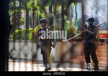 (180509) -- DEPOK, May 9, 2018 -- Officers stand guard outside the headquarters of Mobile Brigade, an elite Indonesian police forces, following a riot at the detention center inside the compound in Depok, West Java, Indonesia, on May 9, 2018. Militants killed five members of an anti-terror squad and is taking another hostage in a prison riot in the outskirts of the capital Jakarta, police said on Wednesday. ) (zjl) INDONESIA-DEPOK-PRISON RIOT AgungxKuncahyaxB. PUBLICATIONxNOTxINxCHN Stock Photo