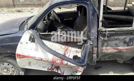 (180511) -- BANNU, May 11, 2018 -- A damaged police vehicle is seen at the blast site in northwest Pakistan s Bannu on May 11, 2018. A policeman was killed and 13 others were injured when a remote-controlled bomb went off near a police vehicle in Pakistan s northwestern Khyber Pakhtunkhwa province on Friday, police said. ) (zxj) PAKISTAN-BANNU-BLAST Stringer PUBLICATIONxNOTxINxCHN Stock Photo