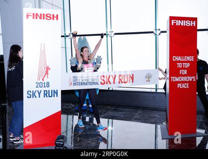 (180513) -- SEOUL, May 13, 2018 -- Suzy Walsham of Australia celebrates after winning the women s category during the Lotte World Tower International Skyrun 2018 in Seoul, South Korea, on May 13, 2018. Runners raced up the 123-floor, 2,917-step, 555-meter-high skyscraper, South Korea s tallest of the kind, on Sunday. ) (SP)SOUTH KOREA-SEOUL-SKYRUN WangxJingqiang PUBLICATIONxNOTxINxCHN Stock Photo