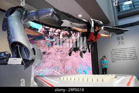 (180513) -- BEIJING, May 13, 2018 -- A visitor experiences VR games at the 14th China (Shenzhen) International Cultural Industrial Fair in Shenzhen, south China s Guangdong Province, May 10, 2018. The Fair opened here on Thursday. ) XINHUA PHOTO WEEKLY CHOICES (CN) MaoxSiqian PUBLICATIONxNOTxINxCHN Stock Photo