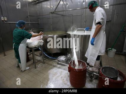 (180519) -- CORINTH, May 19, 2018 -- People work at a cheese factory in Kalliani village of Corinth, some about 70 Km west of Athens, Greece, on May 16, 2018. In the highlands of Corinth prefecture at the Peloponnese peninsula, just two hours from Athens, local agricultural small businesses turn to extroversion to survive the economic crisis. To go with Feature: Greek agricultural community more extrovert in seeking business opportunities. ) (dtf) GREECE-CORINTH-AGRICULTURAL-EXTROVERSION MariosxLolos PUBLICATIONxNOTxINxCHN Stock Photo
