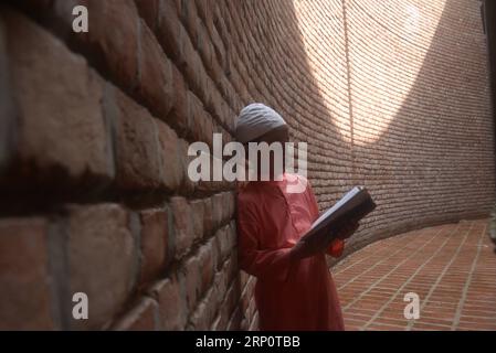 (180524) -- DHAKA, May 24, 2018 () -- A child recites Quran, the Islamic holy book, in Bait Ur Rouf Mosque in Dhaka, Bangladesh on May 24, 2018. () (lrz) BANGLADESH-DHAKA-MOSQUE Xinhua PUBLICATIONxNOTxINxCHN Stock Photo