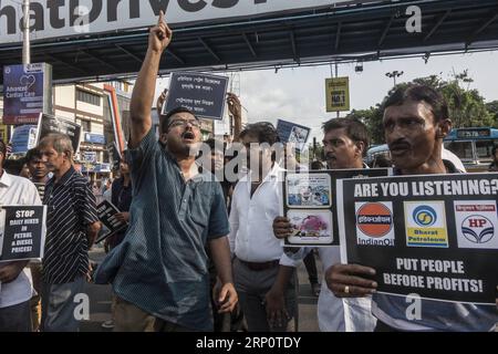 (180524) -- KOLKATA, May 24, 2018 -- People protest against recent price hike of fuel in Kolkata, India, on May 24, 2018. According to a rough estimate, India has the highest retail prices of petrol and diesel among South Asian nations as taxes account for half of the fuel-pump rates. ) (zjl) NDIA-KOLKATA-PROTEST-FUEL PRICE HIKE TumpaxMondal PUBLICATIONxNOTxINxCHN Stock Photo