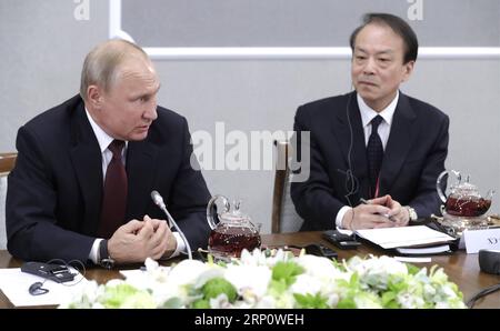 May 25, 2018 - St. Petersburg, Russia - Russian President Vladimir Putin, left, and Xinhua Editor-in-Chief He Ping, right, during a meeting with international news agencies on the sidelines of the 22nd St Petersburg International Economic Forum May 25, 2018 in St. Petersburg, Russia. St. Petersburg Russia PUBLICATIONxNOTxINxCHN - ZUMAp138 20180525 zaa p138 034 Copyright: xMikhaelxKlimentyevx Stock Photo