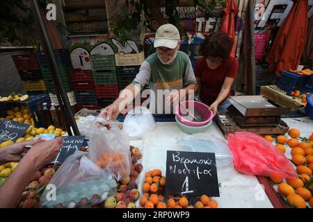 (180527) -- ATHENS, May 27, 2018 -- A couple sell fresh fruits at a farmer s market in Athens, Greece, on May 26, 2018.) (dtf) GREECE-ATHENS-FARMER MARKET-ECONOMY MariosxLolos PUBLICATIONxNOTxINxCHN Stock Photo