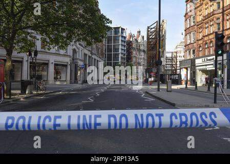 (180606) -- LONDON, June 6, 2018 -- A street is cordoned off after a fire broke out at Mandarin Oriental Hotel in London s Knightsbridge, Britain, on June 6, 2018. A total of 20 fire engines and 120 firefighters and officers are battling a massive blaze at the Mandarin Oriental Hotel in London s Knightsbridge, London Fire Brigade said Wednesday. ) BRITAIN-LONDON-HOTEL-FIRE StephenxChung PUBLICATIONxNOTxINxCHN Stock Photo