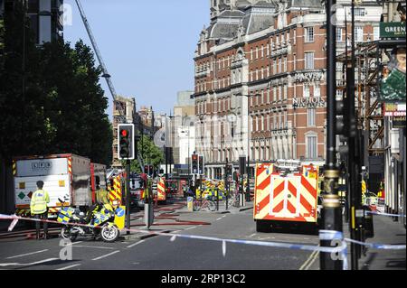 (180606) -- LONDON, June 6, 2018 -- Firefighters and emergency services staff work at the scene after a fire broke out at Mandarin Oriental Hotel in London s Knightsbridge, Britain, on June 6, 2018. A total of 20 fire engines and 120 firefighters and officers are battling a massive blaze at the Mandarin Oriental Hotel in London s Knightsbridge, London Fire Brigade said Wednesday. ) BRITAIN-LONDON-HOTEL-FIRE StephenxChung PUBLICATIONxNOTxINxCHN Stock Photo