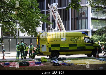 (180606) -- LONDON, June 6, 2018 -- London Ambulance Service staff work at the scene after a fire broke out at Mandarin Oriental Hotel in London s Knightsbridge, Britain, on June 6, 2018. A total of 20 fire engines and 120 firefighters and officers are battling a massive blaze at the Mandarin Oriental Hotel in London s Knightsbridge, London Fire Brigade said Wednesday. ) BRITAIN-LONDON-HOTEL-FIRE StephenxChung PUBLICATIONxNOTxINxCHN Stock Photo