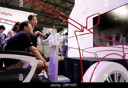 (180613) -- SHANGHAI, June 13, 2018 -- A visitor experiences an intelligent car system during the 2018 CES (Consumer Electronics Show) Asia in Shanghai, east China, June 13, 2018. Nearly 500 companies took part in the CES Asia, which kicked off here on Wednesday. ) (yxb) CHINA-SHANGHAI-CES ASIA (CN) FangxZhe PUBLICATIONxNOTxINxCHN Stock Photo