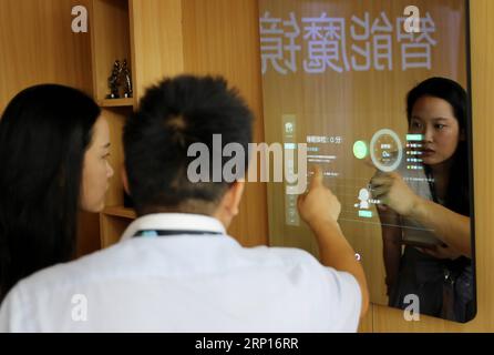 (180613) -- SHANGHAI, June 13, 2018 -- An exhibitor introduces an intelligent health management product during the 2018 CES (Consumer Electronics Show) Asia in Shanghai, east China, June 13, 2018. Nearly 500 companies took part in the CES Asia, which kicked off here on Wednesday. ) (yxb) CHINA-SHANGHAI-CES ASIA (CN) FangxZhe PUBLICATIONxNOTxINxCHN Stock Photo