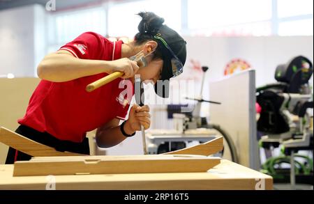 (180613) -- SHANGHAI, June 13, 2018 -- A competitor processes wood during the national selection match of the 45th Worldskills Competition in Shanghai, east China, June 13, 2018. About 900 competitors of 46 representative teams from across China will take part in the national selection match here. ) (zwx) CHINA-SHANGHAI-WORLDSKILLS COMPETITION (CN) FangxZhe PUBLICATIONxNOTxINxCHN Stock Photo