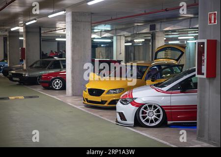 A meeting of tuned Spanish cars in a garage Stock Photo